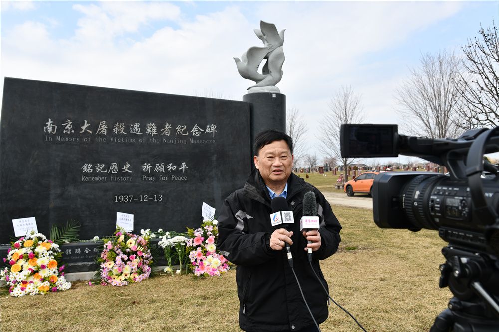 A person standing in front of a gravestone with a bird on it

Description automatically generated with medium confidence