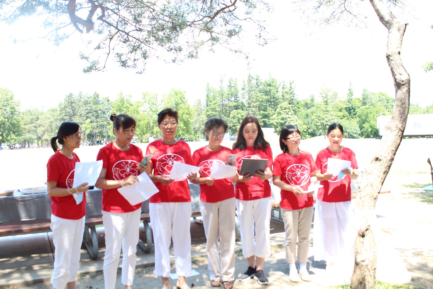 A group of people wearing matching t-shirts Description automatically generated with medium confidence