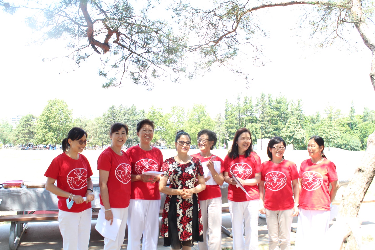 A group of people wearing matching t-shirts Description automatically generated with medium confidence