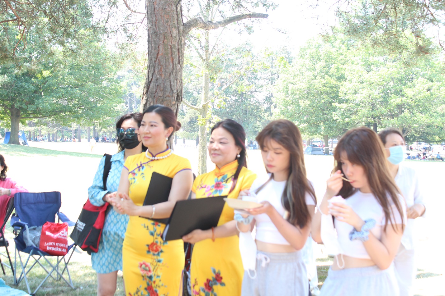 A group of women standing outside Description automatically generated with low confidence