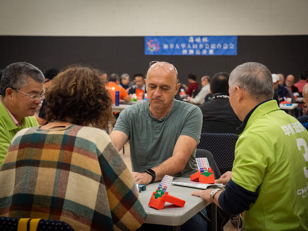 A group of people sitting at a table

Description automatically generated