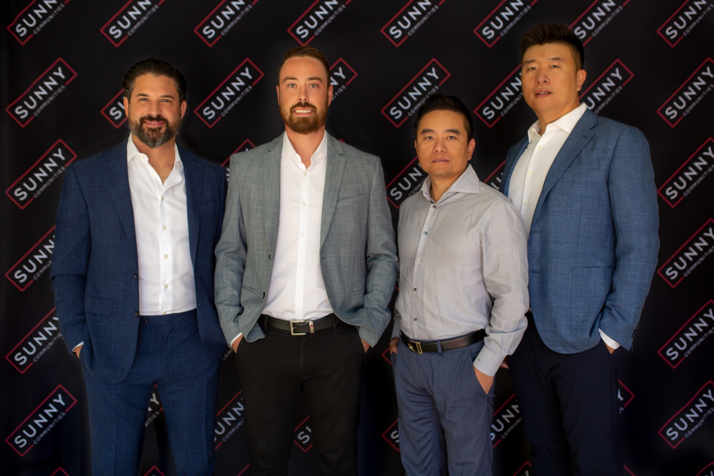 A group of people posing for a photo

Description automatically generated