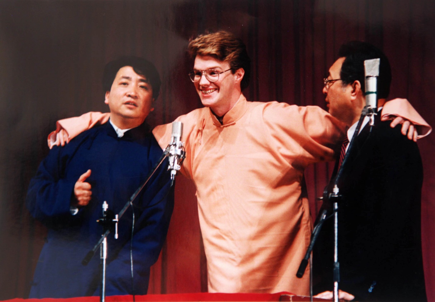 A group of men standing on a podium

Description automatically generated