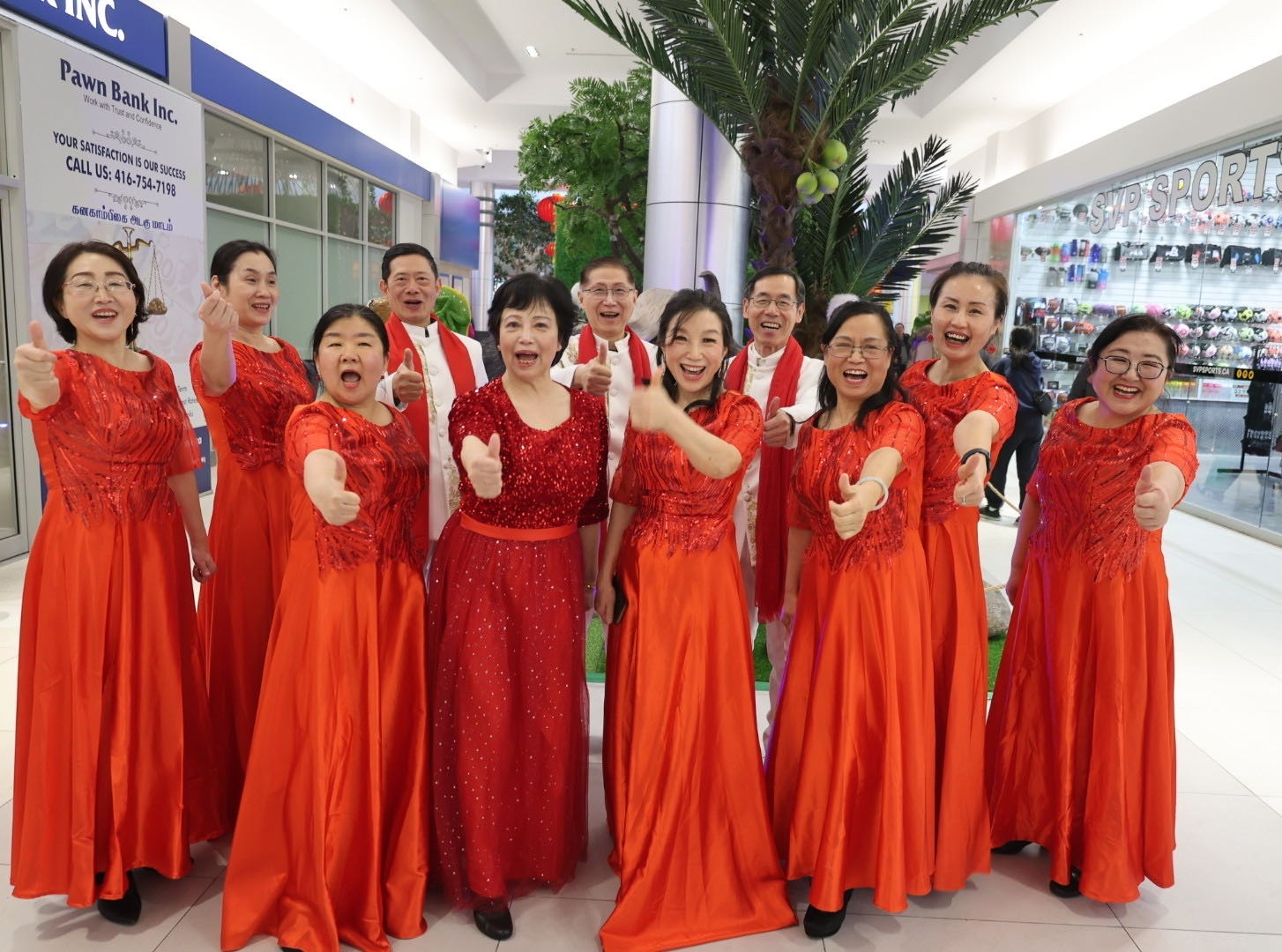 A group of people wearing red dresses

Description automatically generated