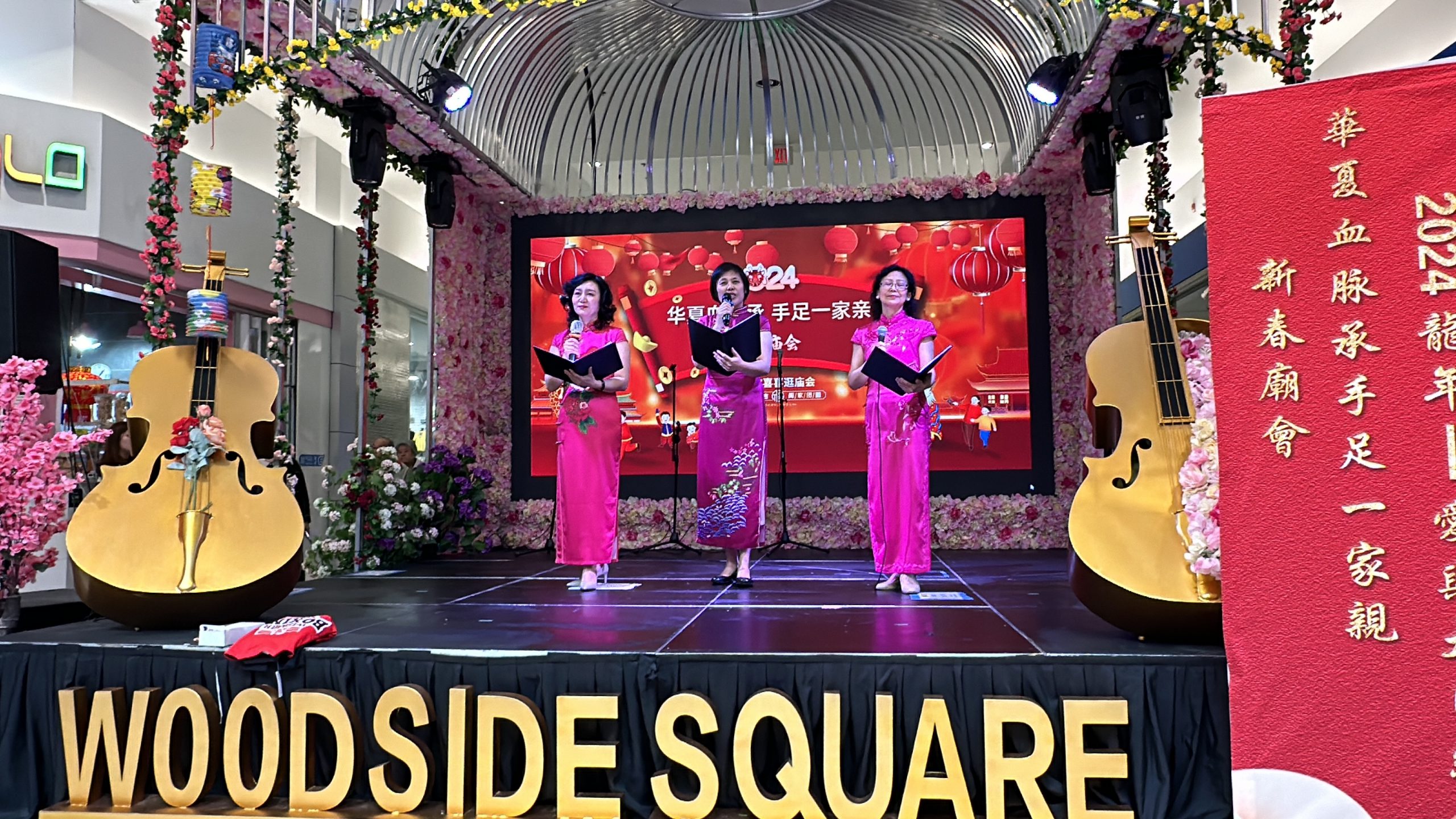 A group of women performing on a stage

Description automatically generated