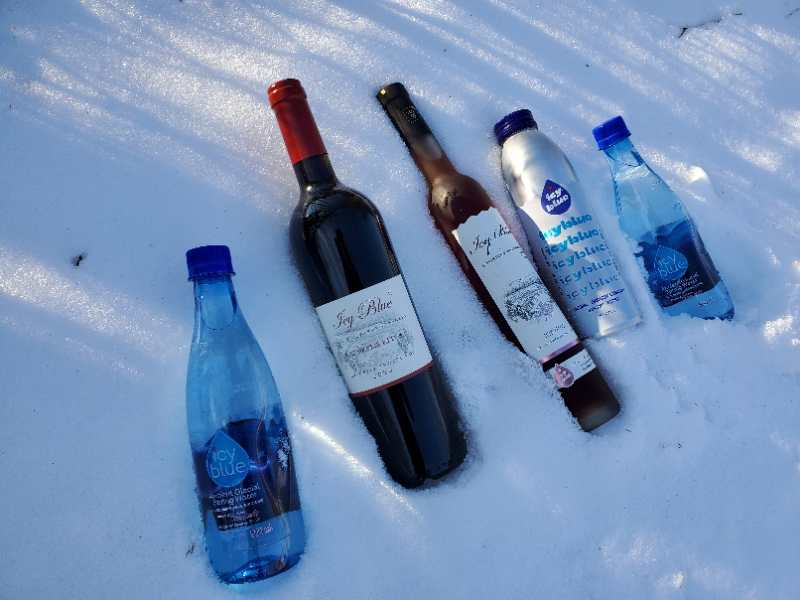 Bottles in the snow

Description automatically generated