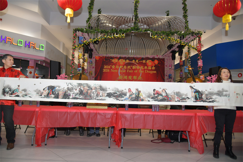 Long table with red tablecloths Description automatically generated