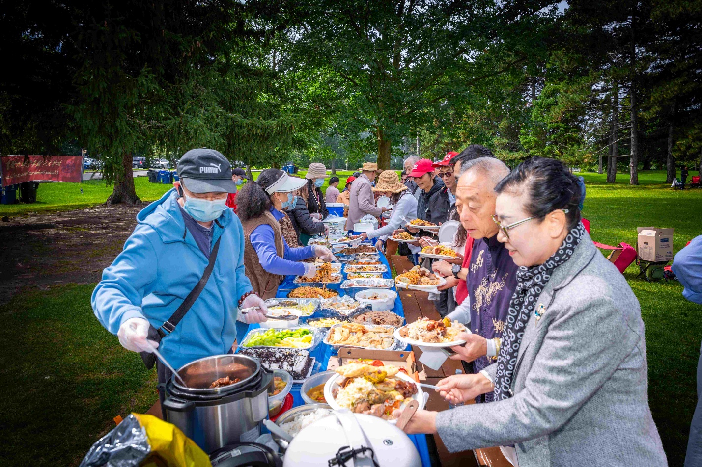 A group of people at a buffet Description automatically generated