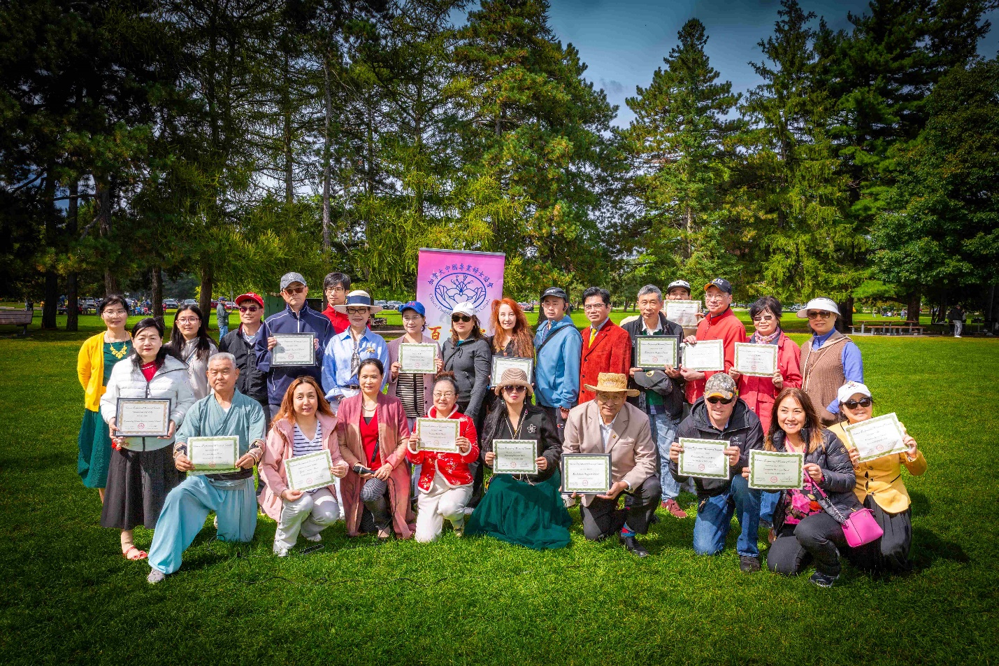 A group of people holding signs Description automatically generated