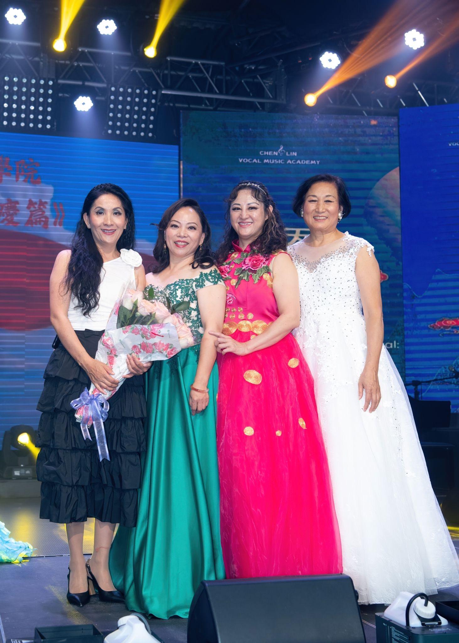 A group of women posing for a photo

Description automatically generated