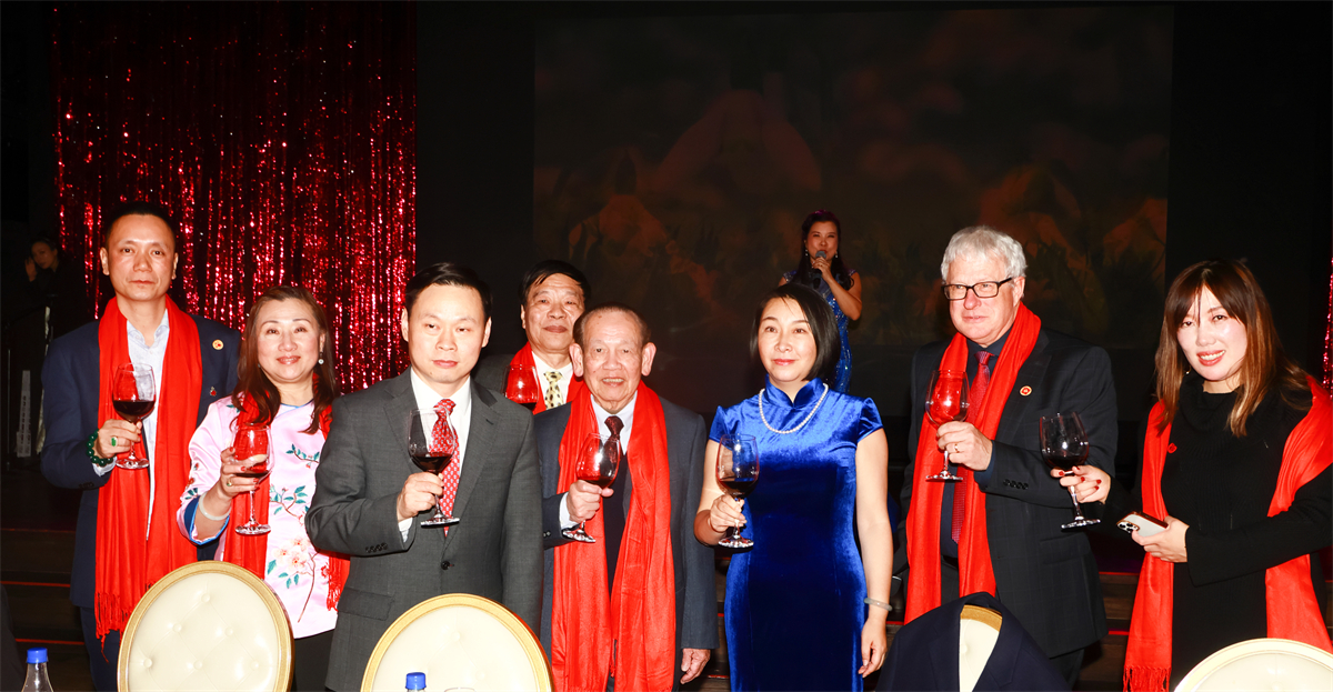 A group of people standing together holding wine glasses AI-generated content may be incorrect.